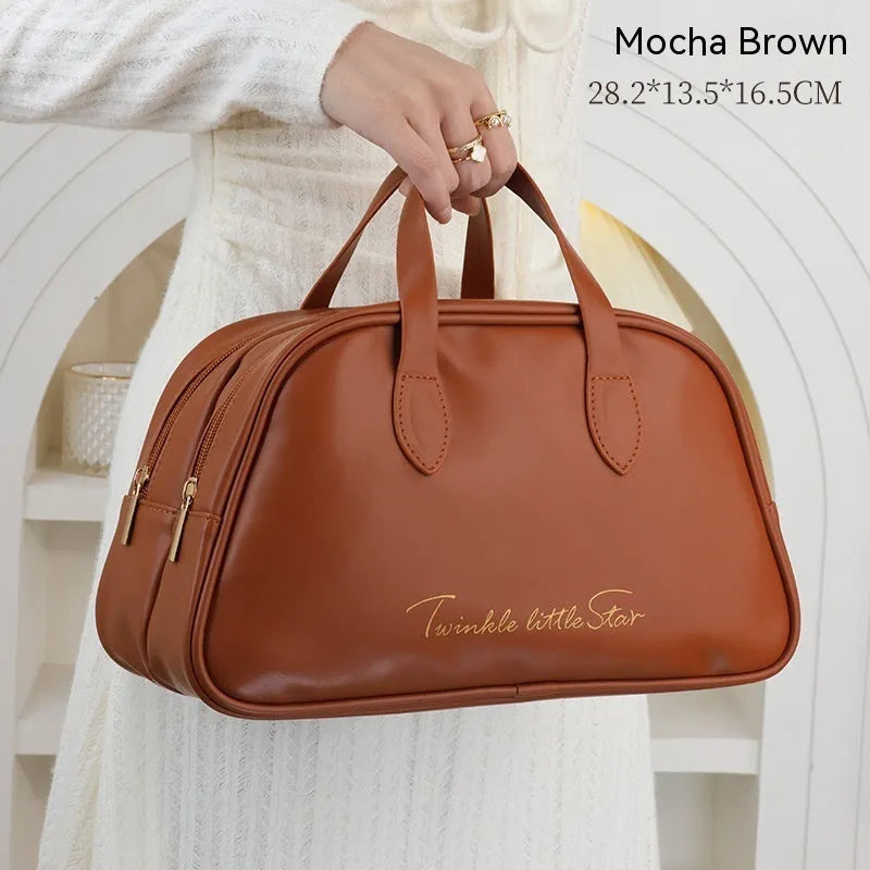 Leather travel toiletry bag in caramel mocha colour with large capacity and dry-wet separation compartments.