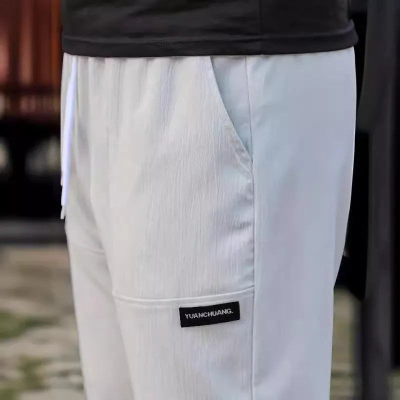 Men's polyester trousers for spring and autumn available in multiple colours and sizes