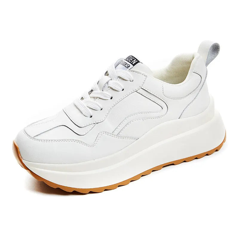 Beige women's low-top leather shoes with cross-strap detail and English muffin heel.