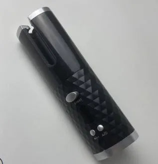 White portable mini curling iron with USB charging port and adjustable temperature dial.