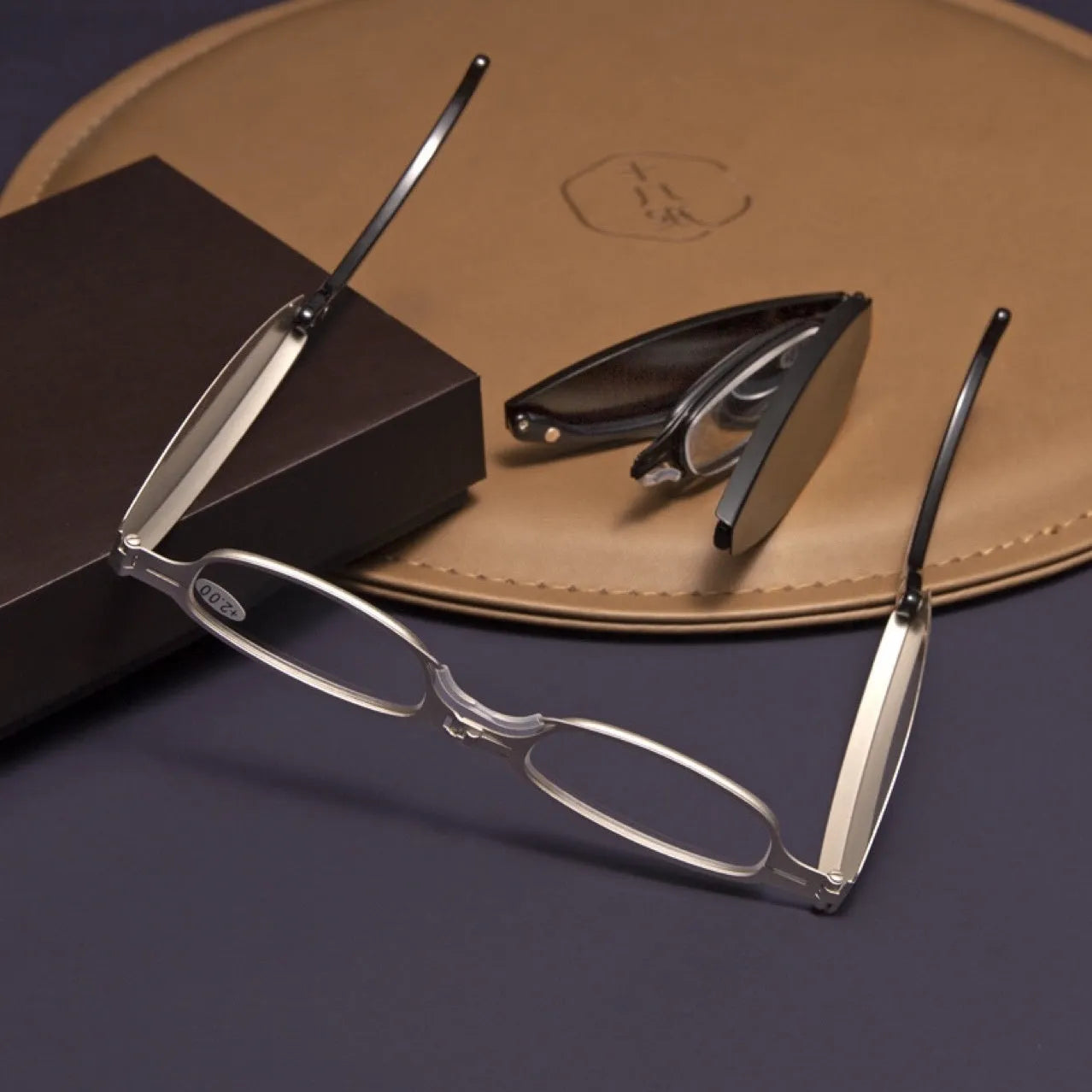Folding presbyopic reading glasses with retro metal frame shown open and folded in pocket case