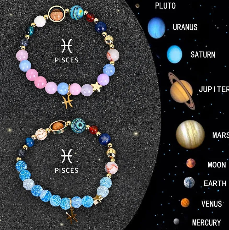 Two adjustable natural stone beaded bracelets with metal zodiac sign charms on a wooden surface.