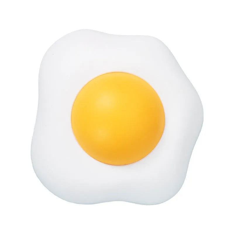 Catnip ball toy in fried egg and poached egg shapes with adhesive backing for wall mounting