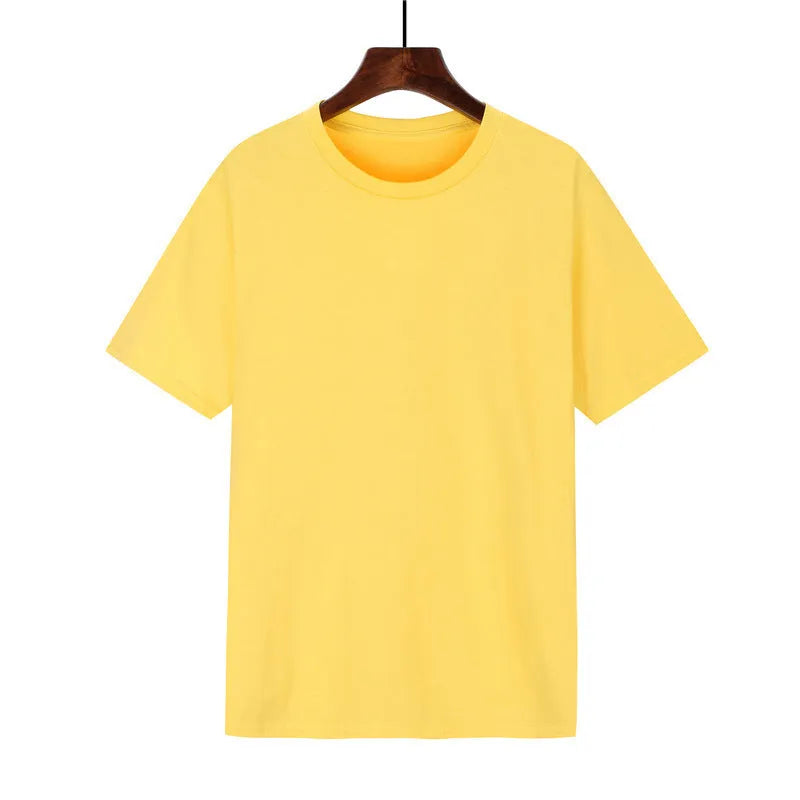Man wearing a black loose-fit cotton T-shirt, short sleeves, crew neck.