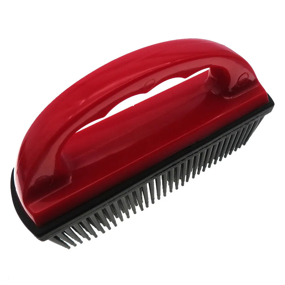 Red pet hair removal and massage brush for grooming and carpet cleaning.