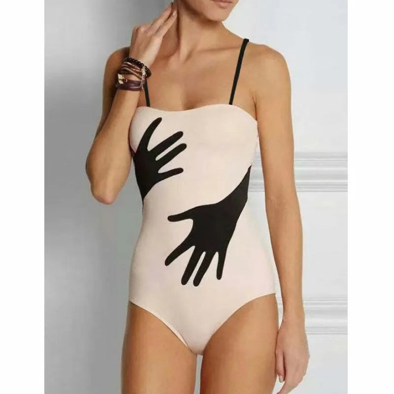 Women's one-piece bikini swimsuit with a light gauze skirt attached, shown on a model.