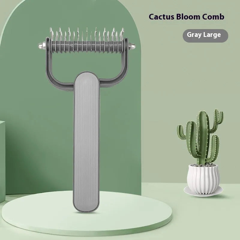 Green and grey dog hair unknotting comb with stainless steel teeth on a plastic handle.