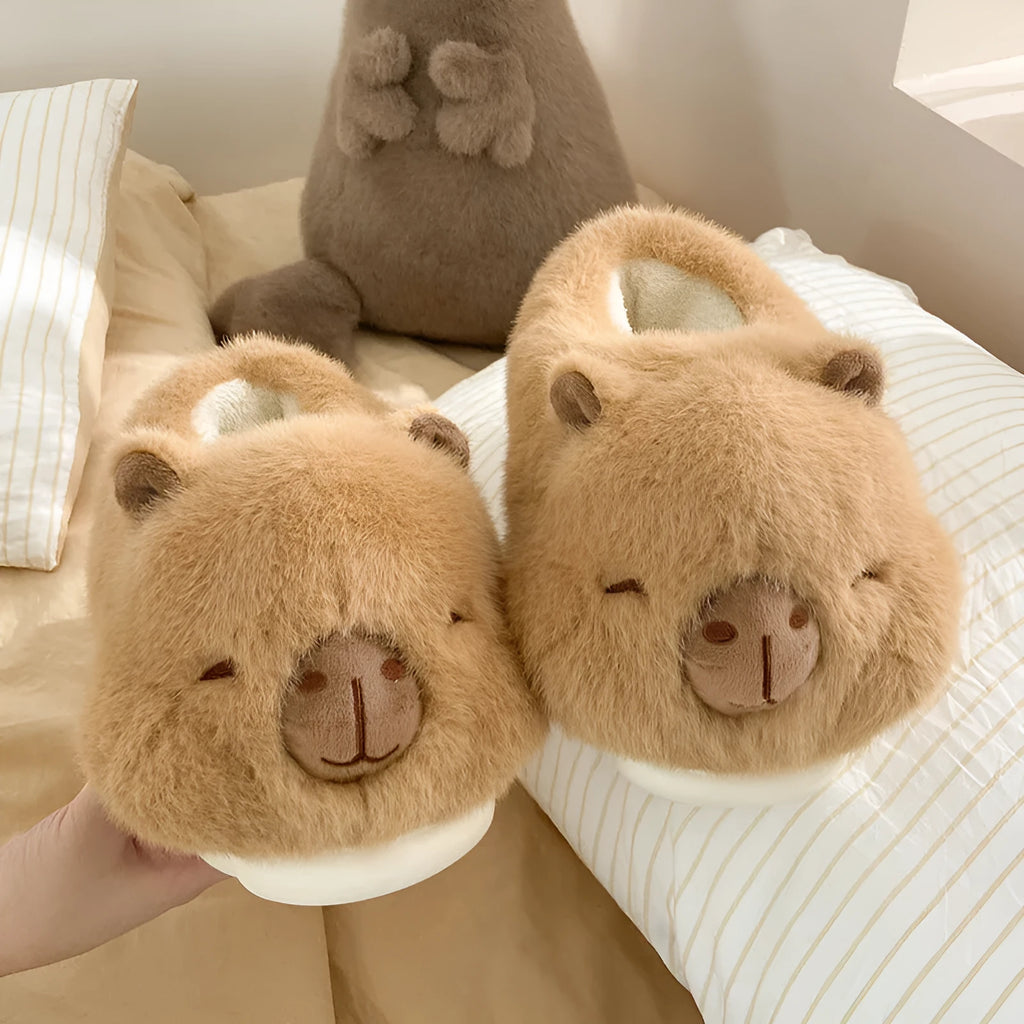 Light brown women's plush winter slippers with artificial wool lining and a PVC sole.