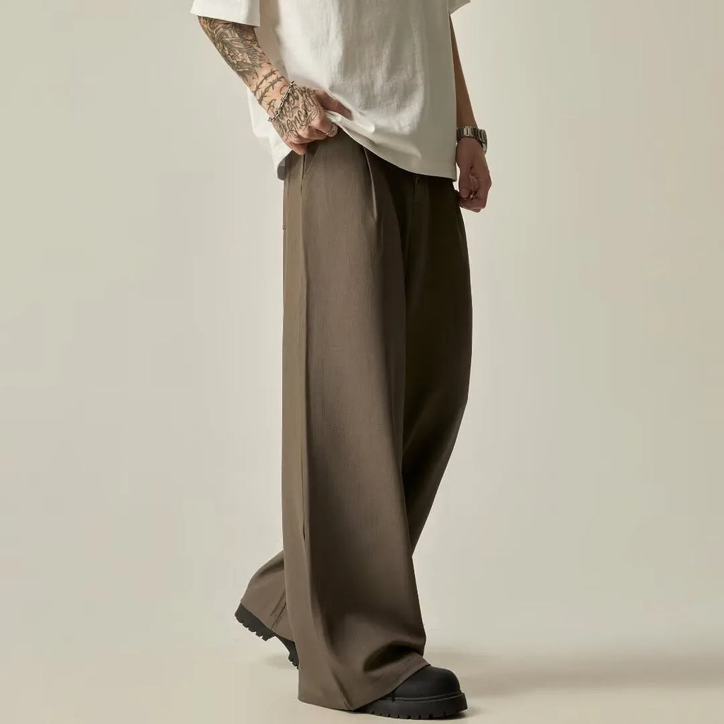 Men's solid black vertical tube wide-leg casual trousers with a button fly and straight-leg style.
