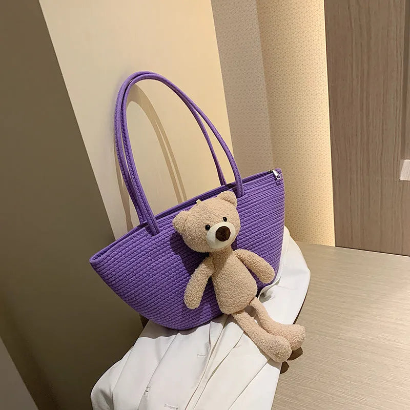 Cotton and linen woven shoulder bag with dumpling shape and double straps in multiple colours