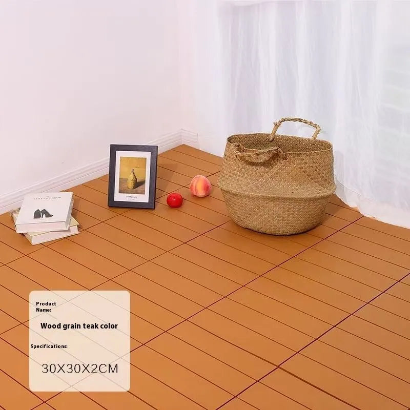 Pack of ten wood grain plastic interlocking floor tiles showing splicing edges.