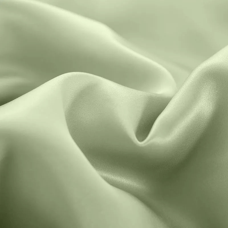 Double-sided silk duvet cover in bright brown colour, shown on a bed.