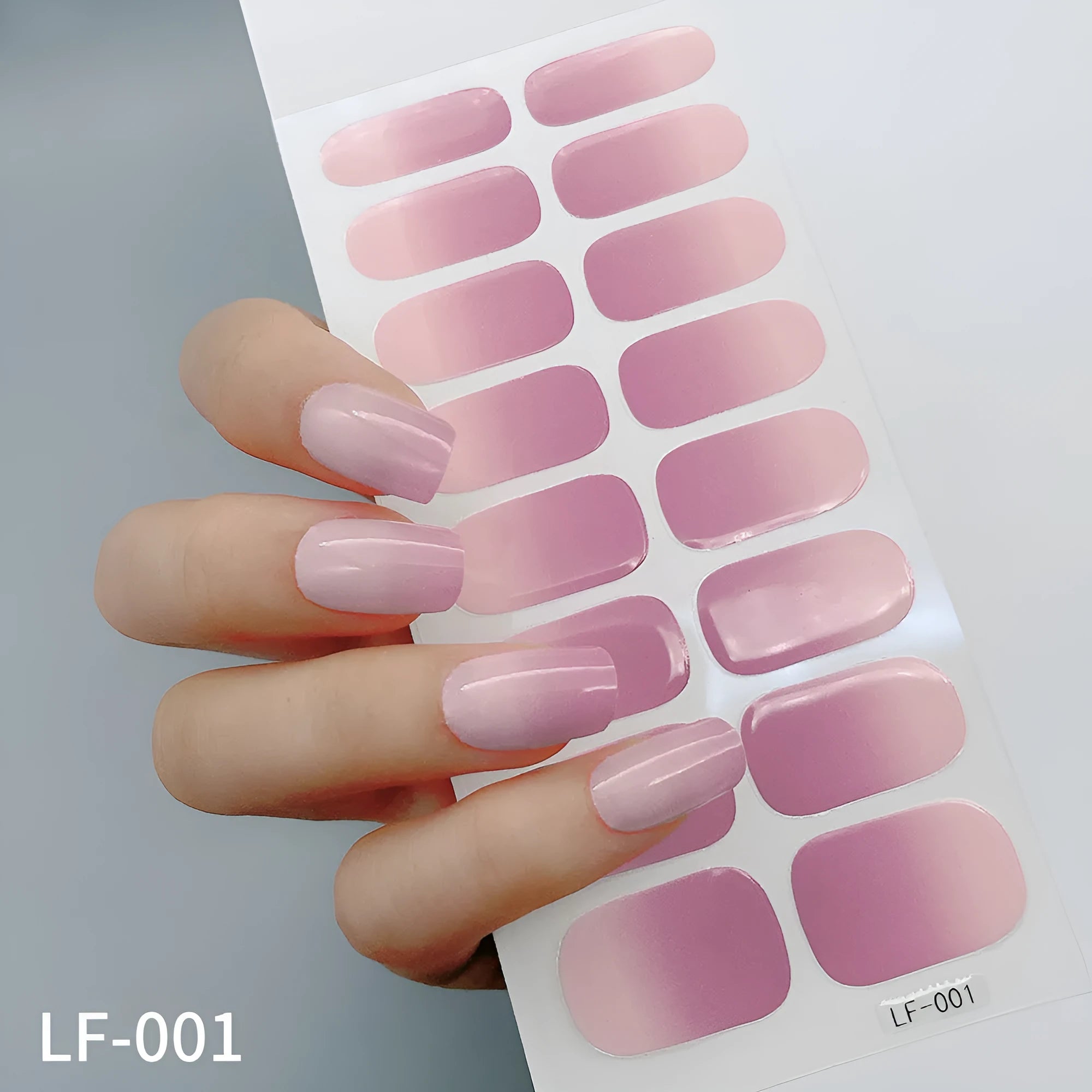 Set of 16 solid colour nail art stickers showing floral, geometric, and pattern designs for manicure application