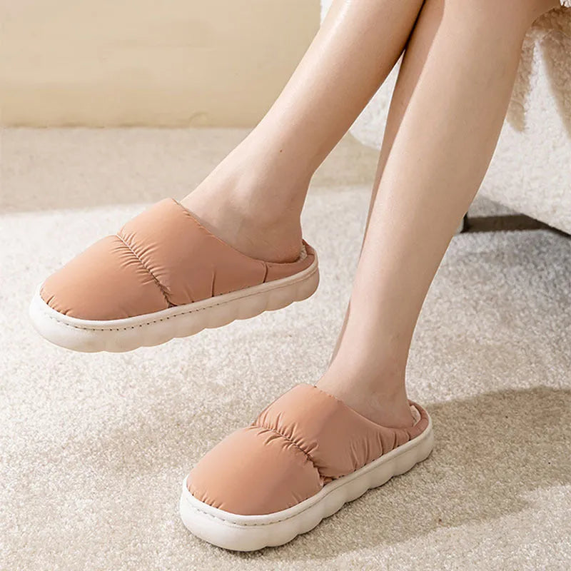 Blue winter slippers with artificial leather upper and thick rubber sole, showing plush lining.