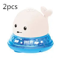 Electric whale-shaped baby bath toy with water spray, LED lights, and automatic water sensor