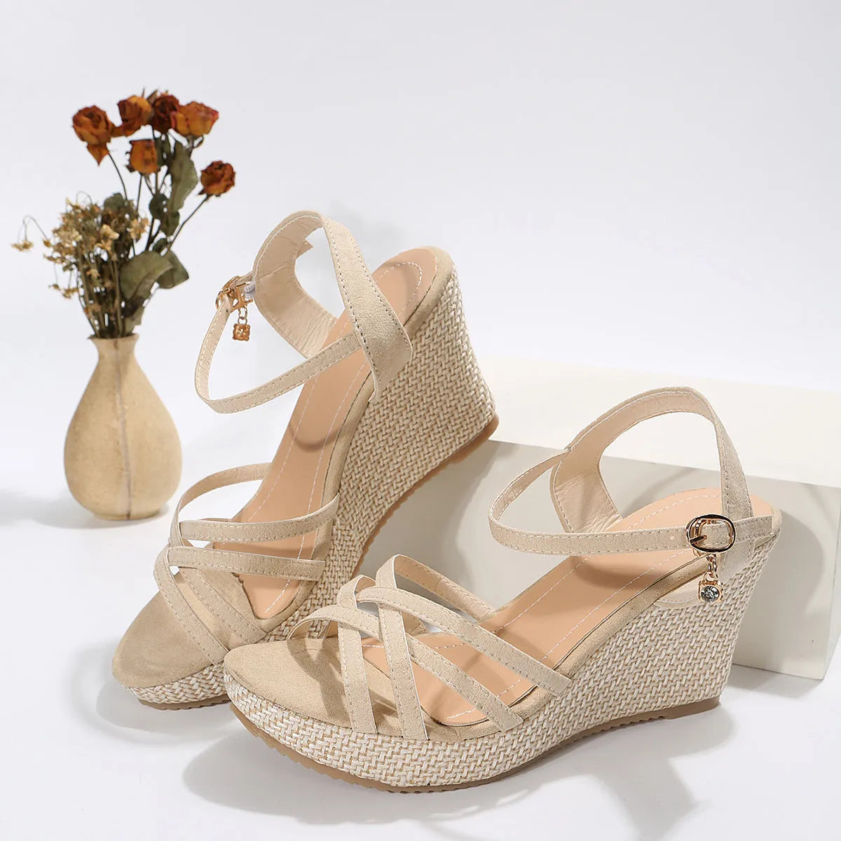 Women's wedge sandals with fish mouth toe design in black cloth material showing wedge heel