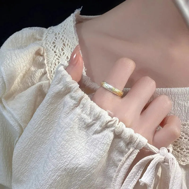 Geometric Xiangyun pattern open-mouth ring with silver and gold electroplated finish on white copper.