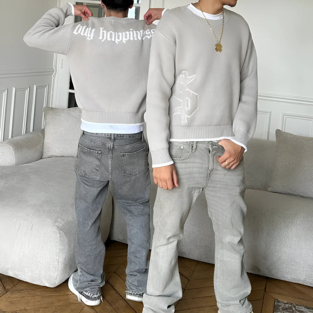 Grey loose-fitting jacquard pattern knitwear coat with long sleeves on hanger
