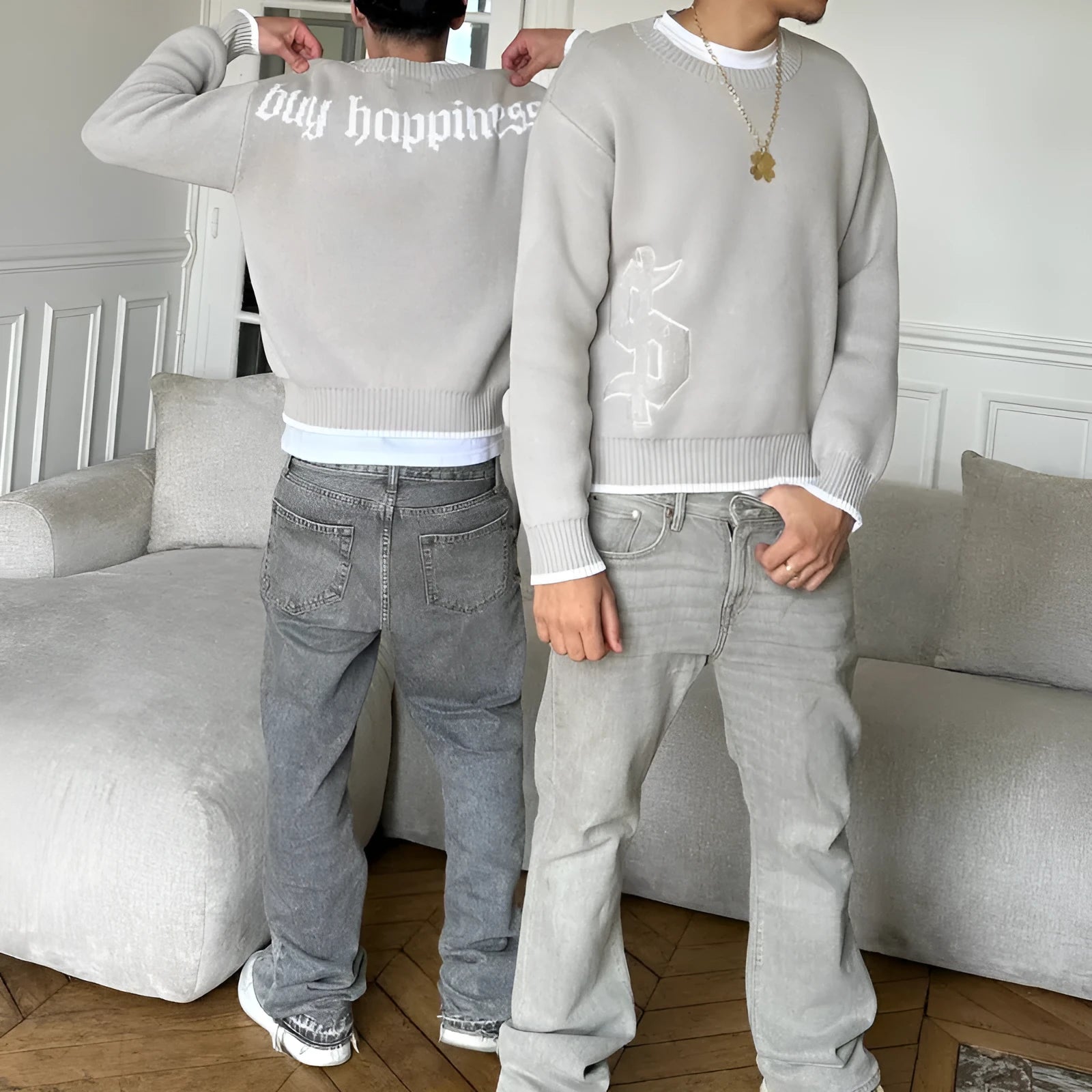 Grey loose-fitting jacquard pattern knitwear coat with long sleeves on hanger