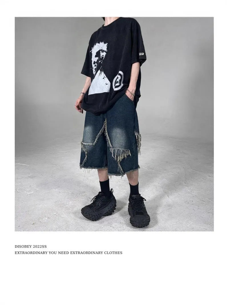 Blue men's denim shorts with a frayed hem and a large five-pointed star design on the leg.