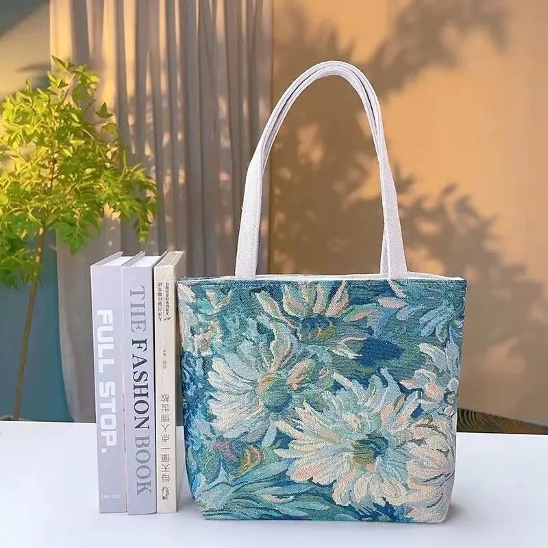 Handheld canvas bag with gold wire embroidery, shown in one of seven colour designs.