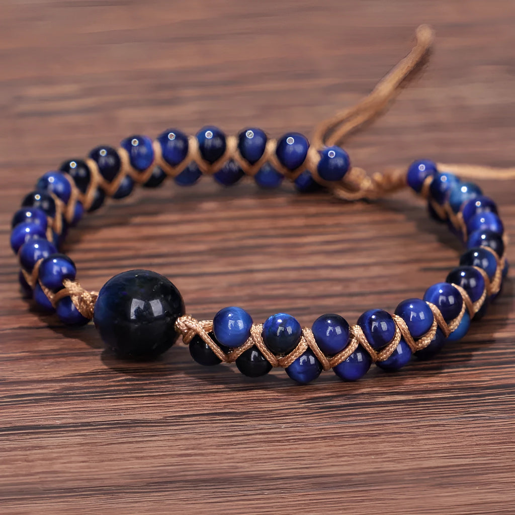 Handwoven geometric pull bracelet in blue tiger eye stone beads with adjustable closure