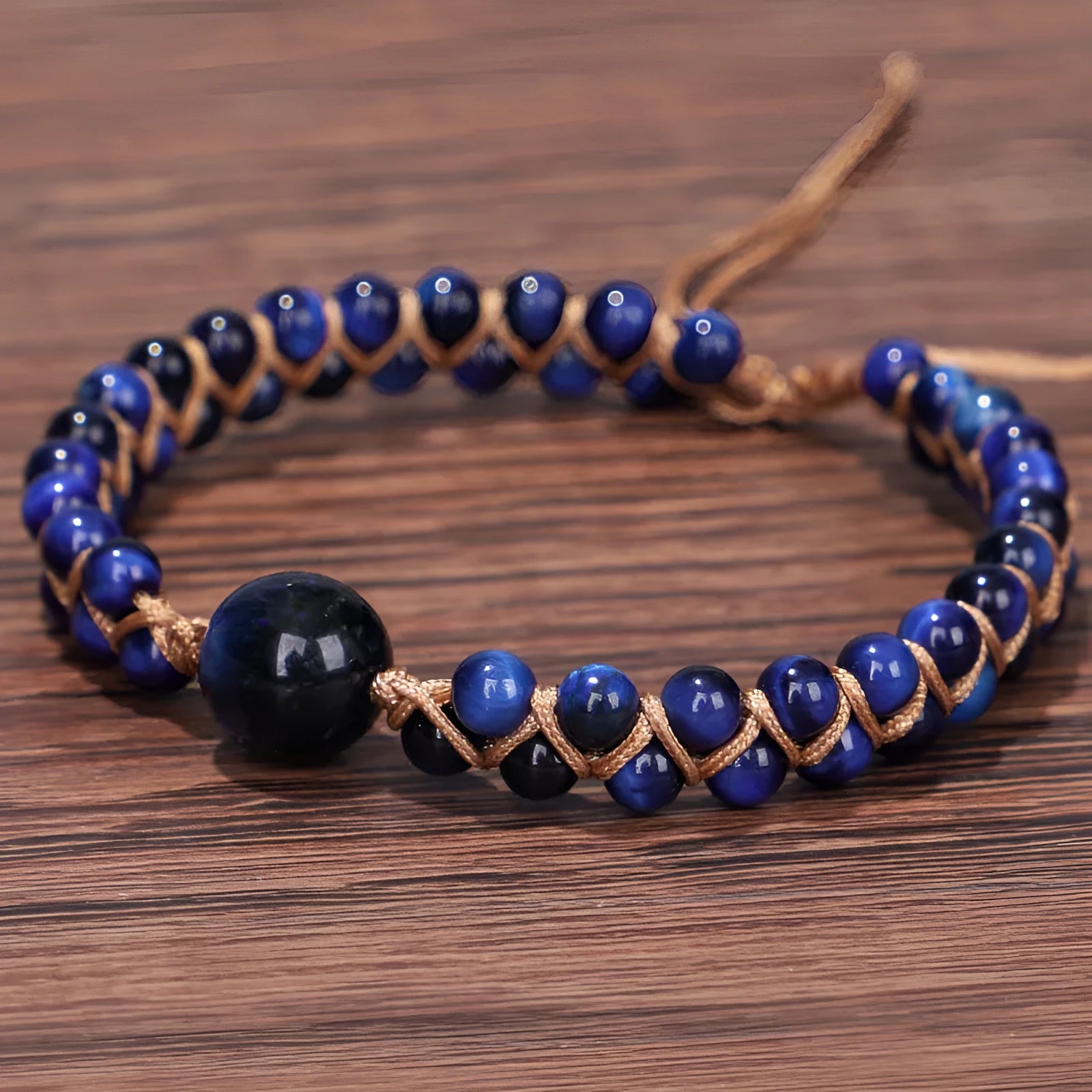 Handwoven geometric pull bracelet in blue tiger eye stone beads with adjustable closure