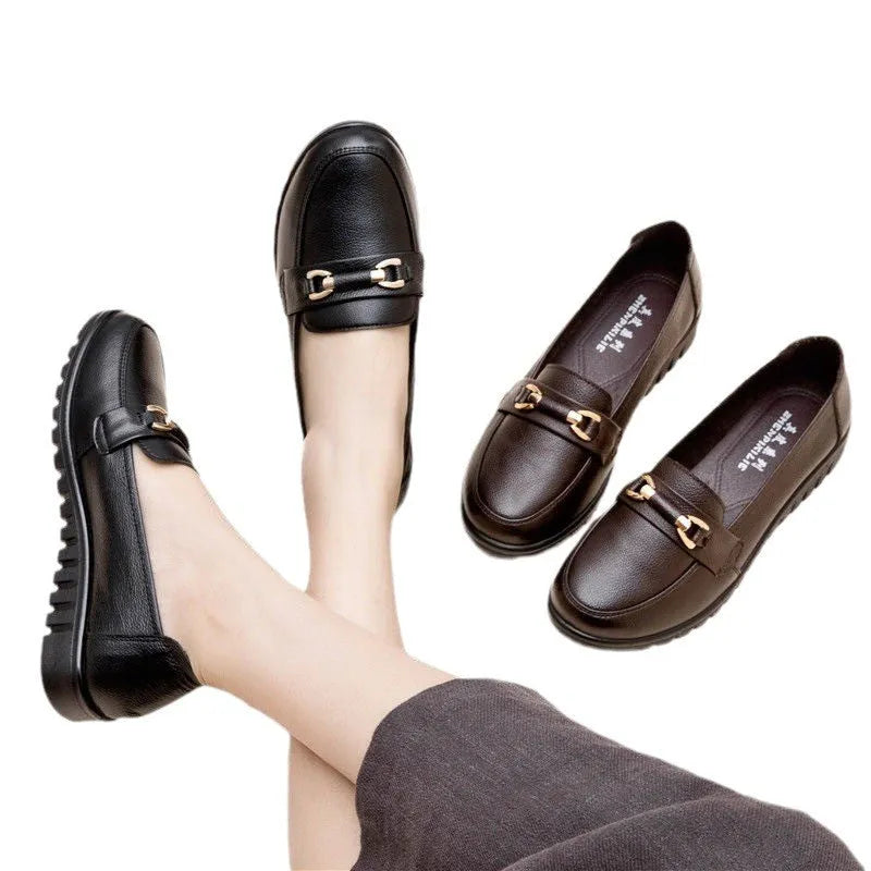 Black women's casual leather pumps with a round toe and soft rubber sole.