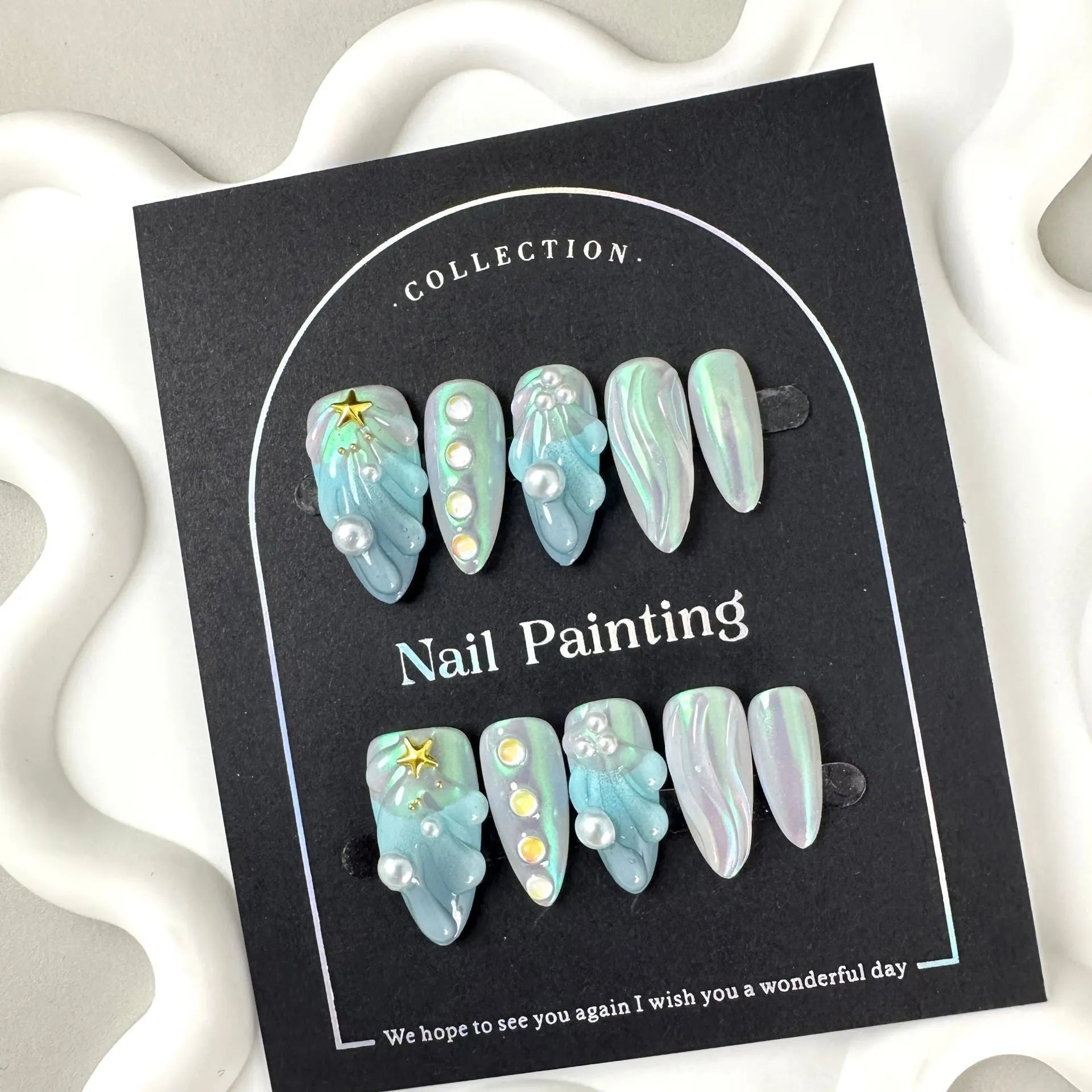 HAILANG blue plastic false nail tips set showing shell design with XS, S, M, L sizes.