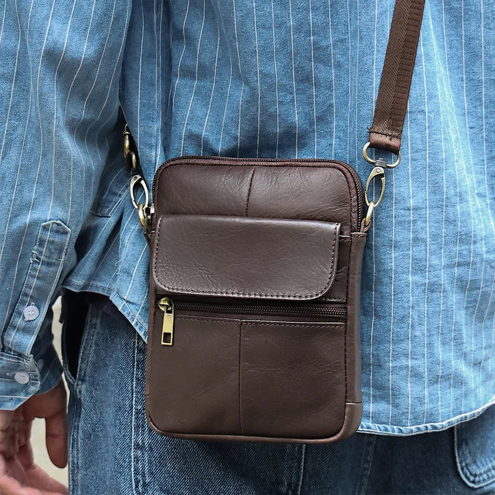 Men's brown genuine leather crossbody shoulder bag showing sewing line details.