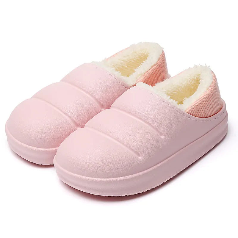 Women's green waterproof EVA winter slippers with plush lining and a non-slip sole.