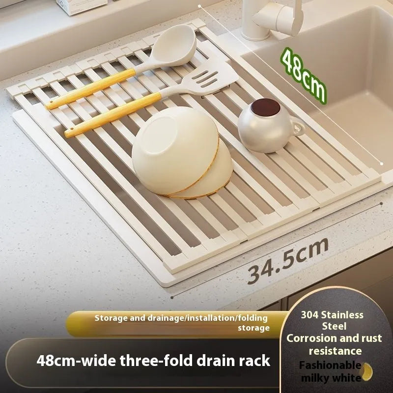 Milky white foldable stainless steel kitchen draining rack next to a sink.