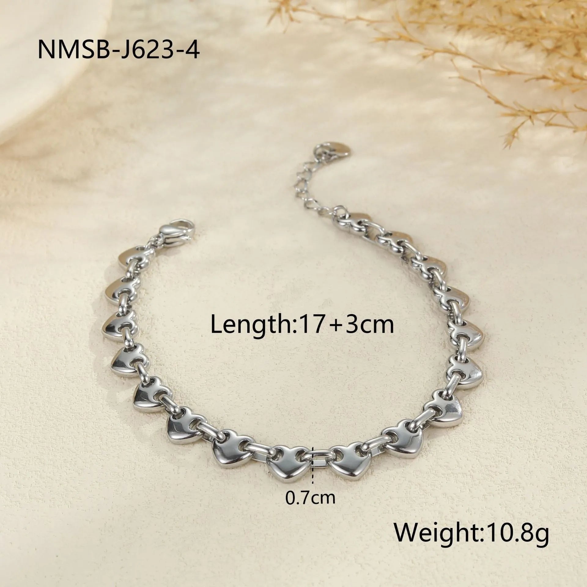 Hollowed-out heart bracelet in stainless steel with 18K gold plating showing simple geometric design