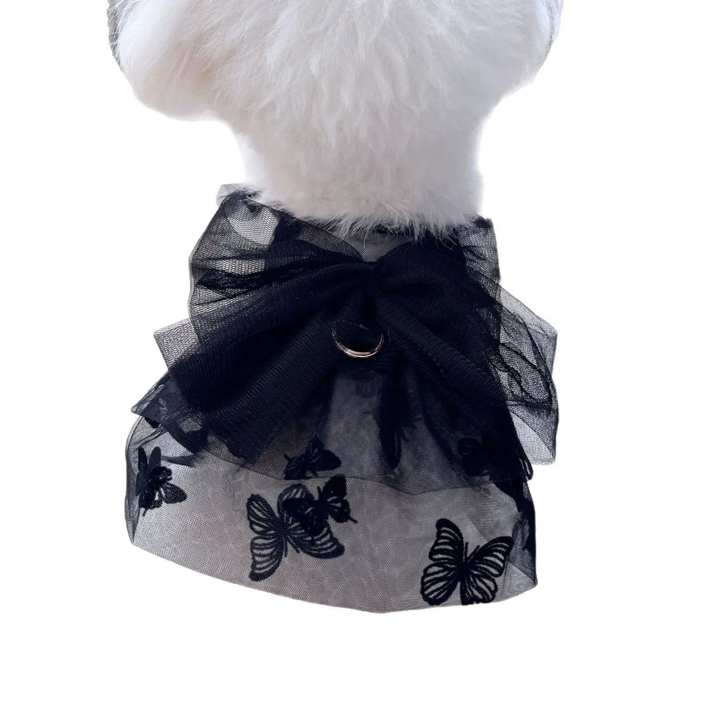Black polyester tulle princess skirt costume for a small dog or cat on a mannequin, showing the gauzy fabric.