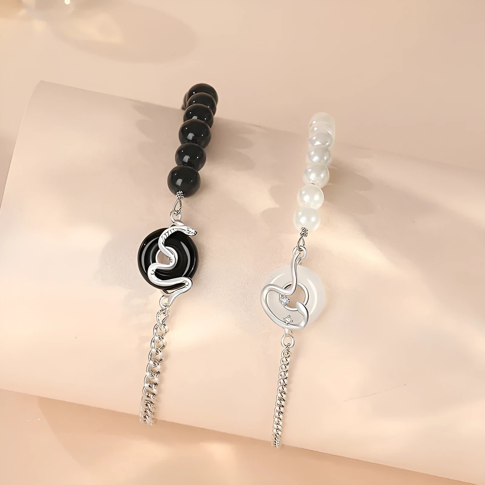 925 sterling silver couple bracelet with snake design, obsidian pearls, and a safe buckle.
