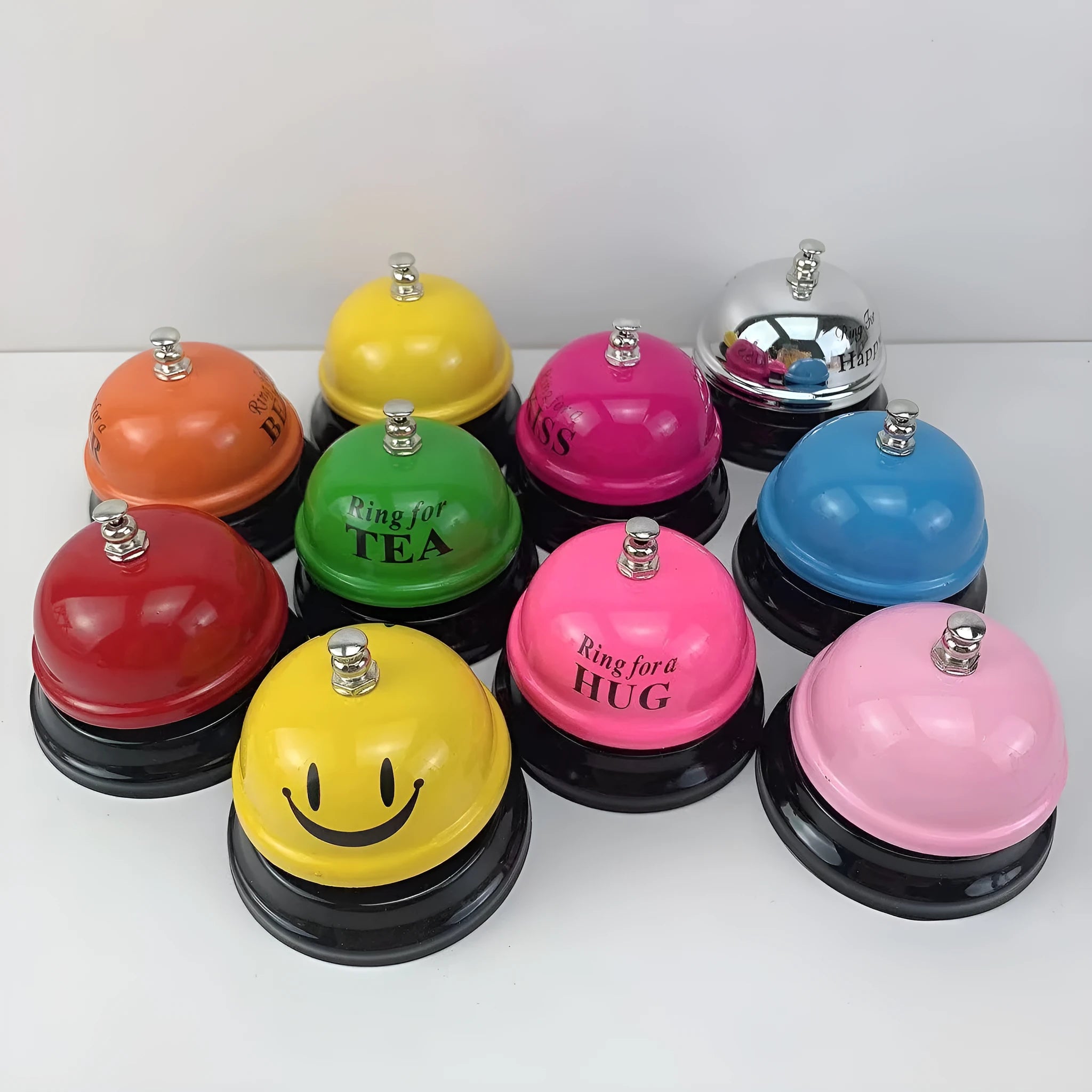 Handheld iron game bell in one of ten colours like red, blue, or green tea, for classroom or restaurant use.