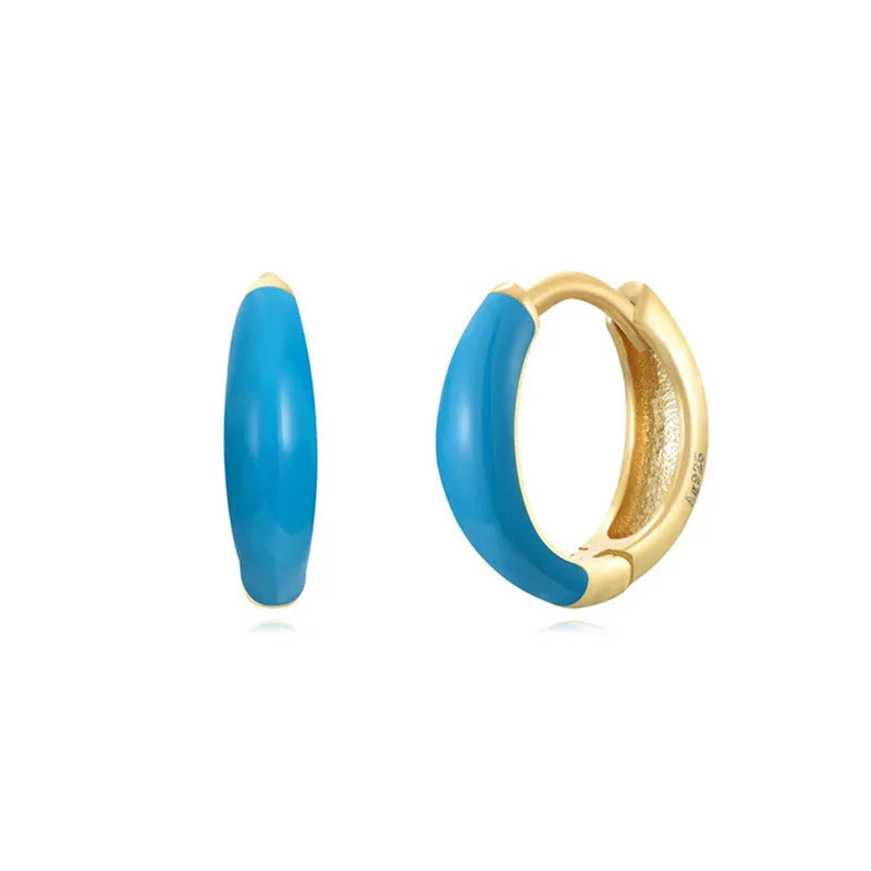Geometric U-shaped silver wire drop earrings with glossy oval epoxy resin elements in various colours.