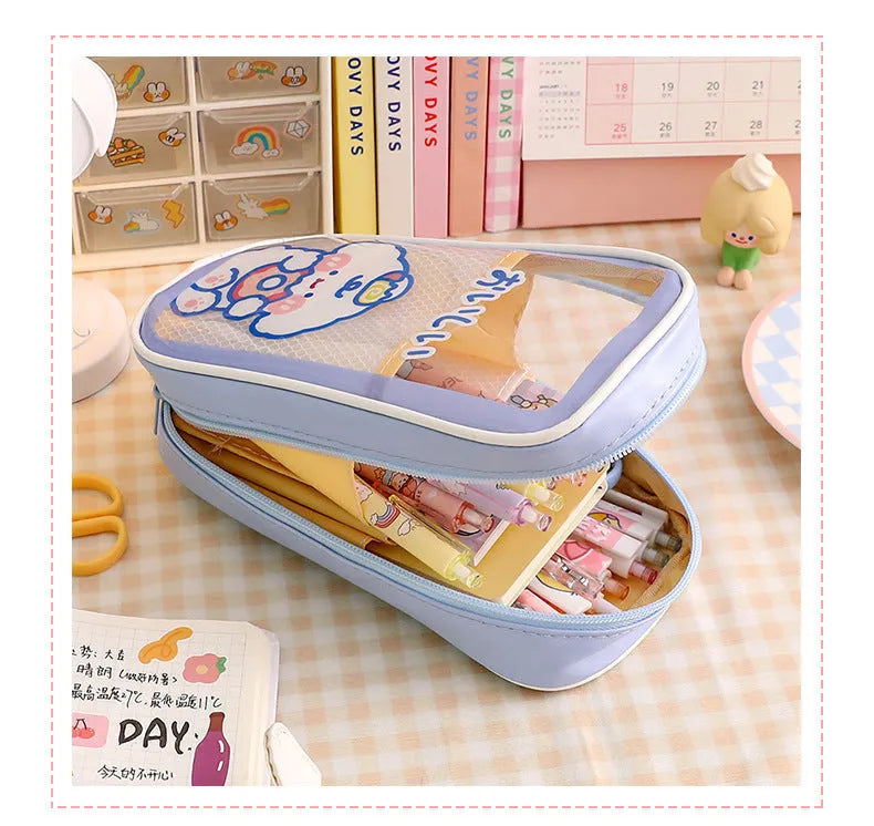 Transparent PVC pencil case with cartoon pattern, showing large capacity design for stationery storage