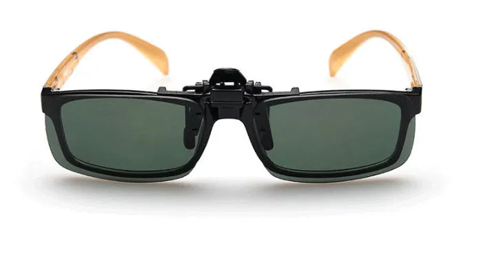 A pair of polycarbonate clip-on sunglasses for prescription glasses, shown in a dark green tint.