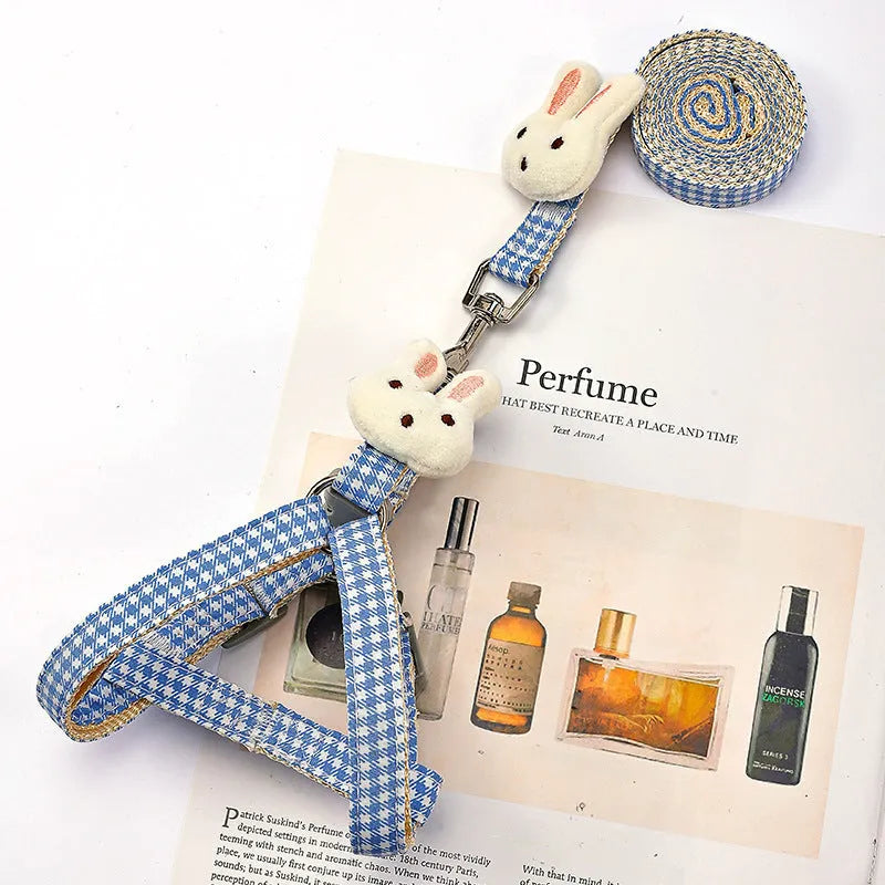 Blue nylon dog harness with quick release buckle and matching leash for small pets.