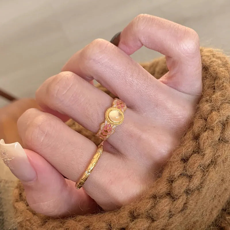 Geometric pink crystal enamel open ring with gold plating showing adjustable design