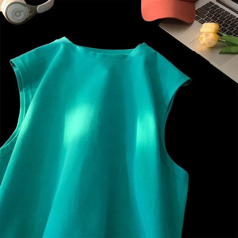Men's loose solid colour cotton tank top on hanger showing straight hem design