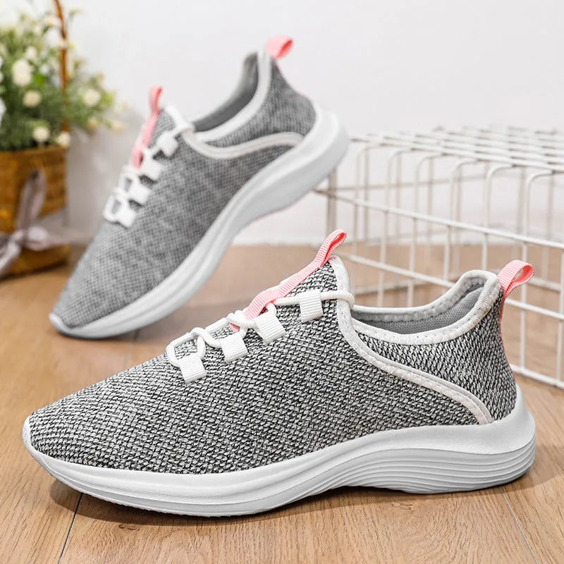 Women's low-top casual sneakers in mesh with lace-up front and EVA sole, shown in black colour.