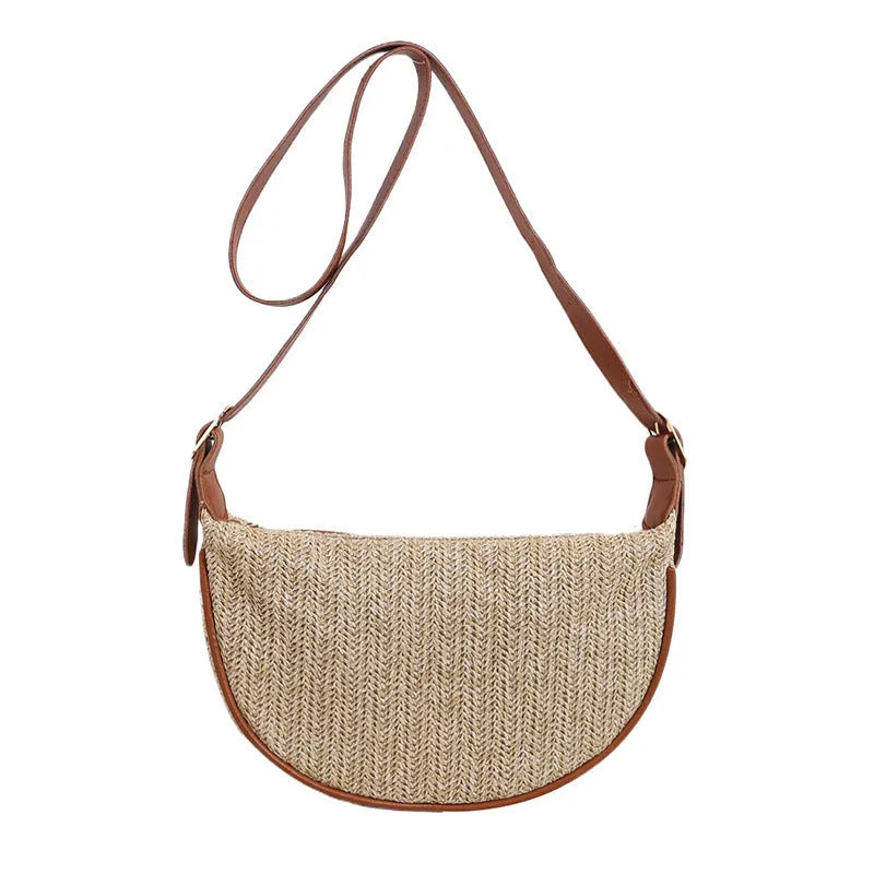 Women's woven straw crossbody bag showing internal phone pocket and file compartment