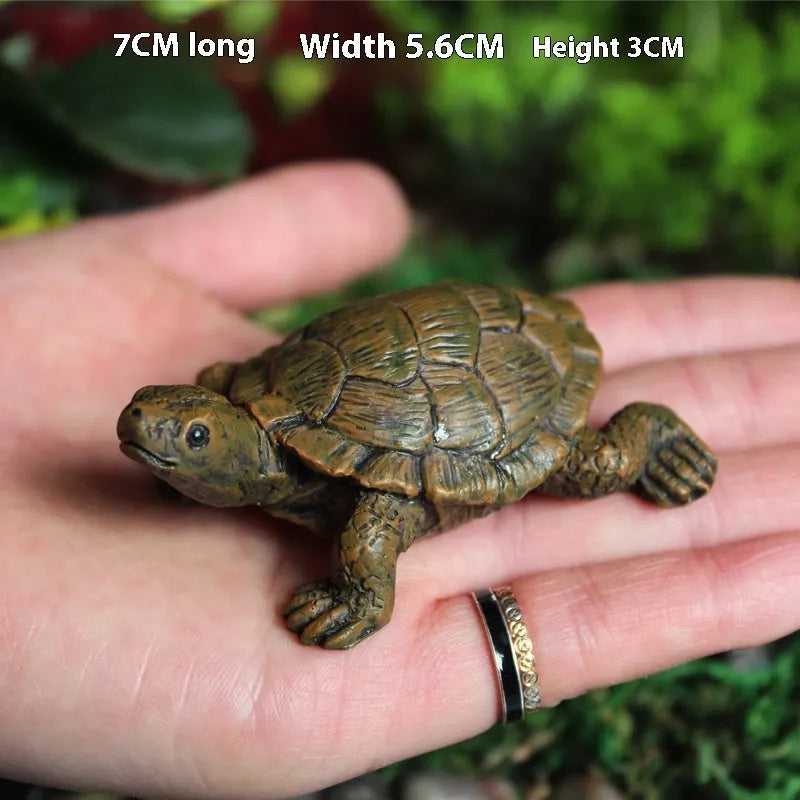 Small brown resin simulation turtle ornament for fairy garden or terrarium decoration.