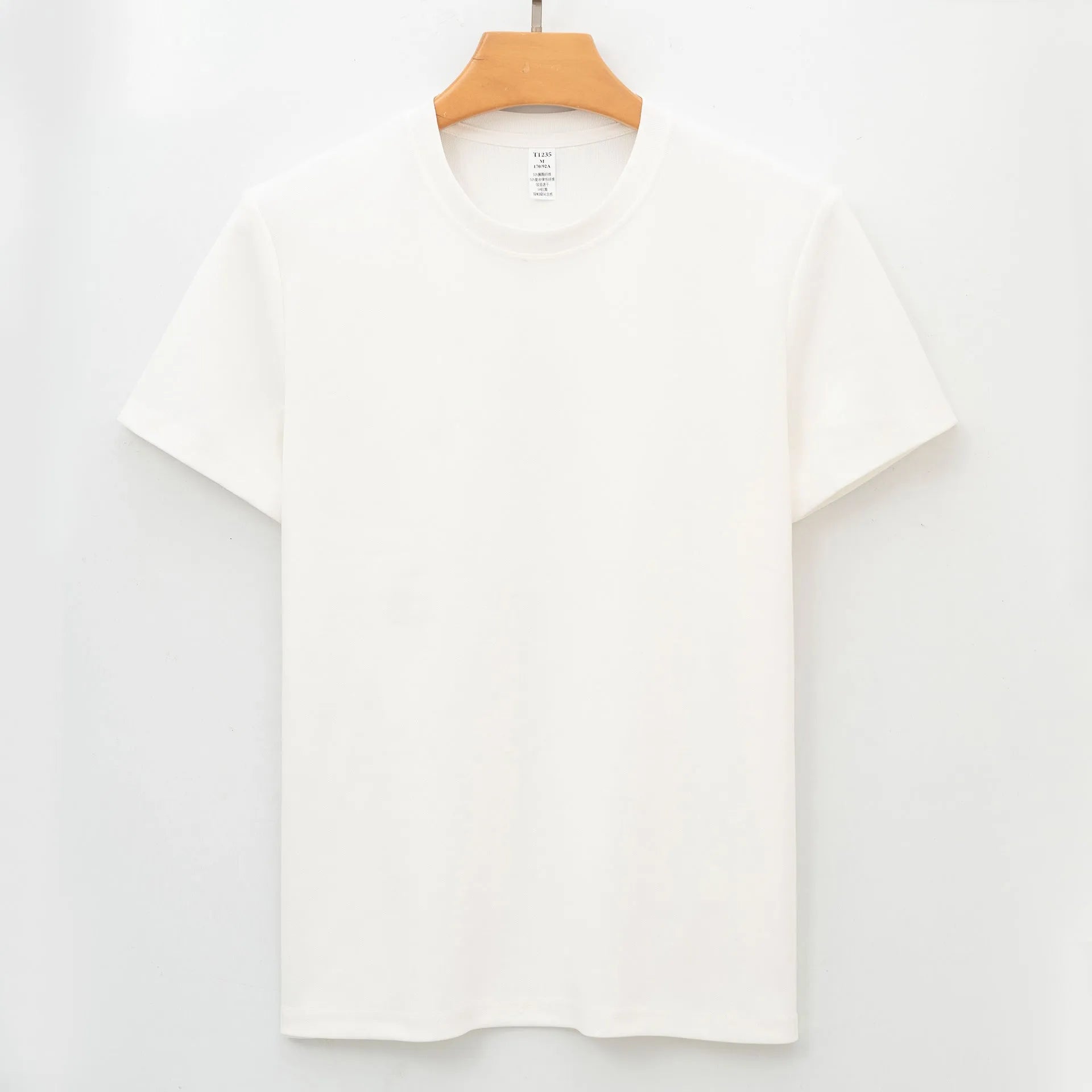 Men's solid colour quick-dry antibacterial short sleeve t-shirt on a hanger.