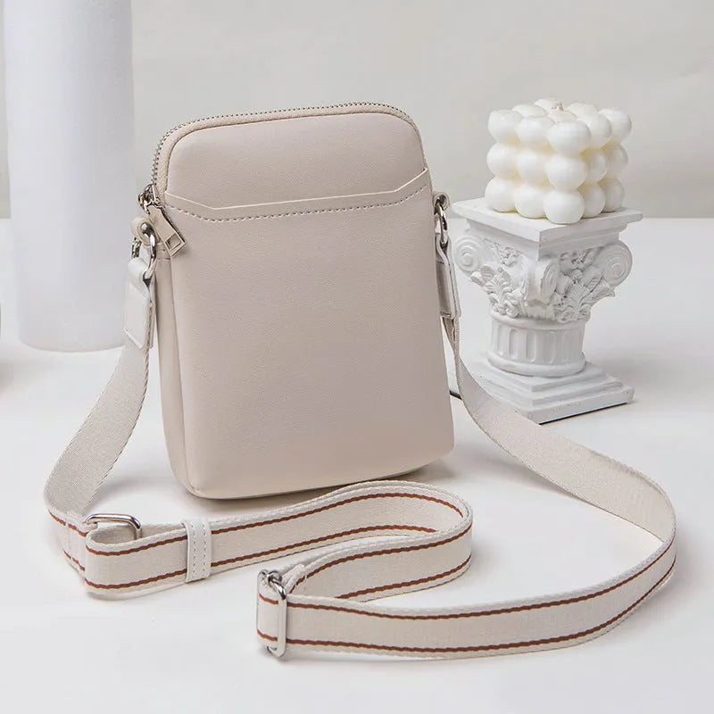 Solid colour PU leather crossbody phone bag for women shown in beige.