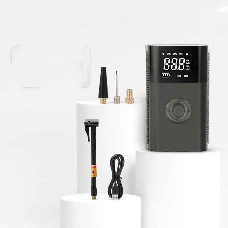 Handheld wireless digital display tyre pump with LED light and multiple nozzle attachments on a white background