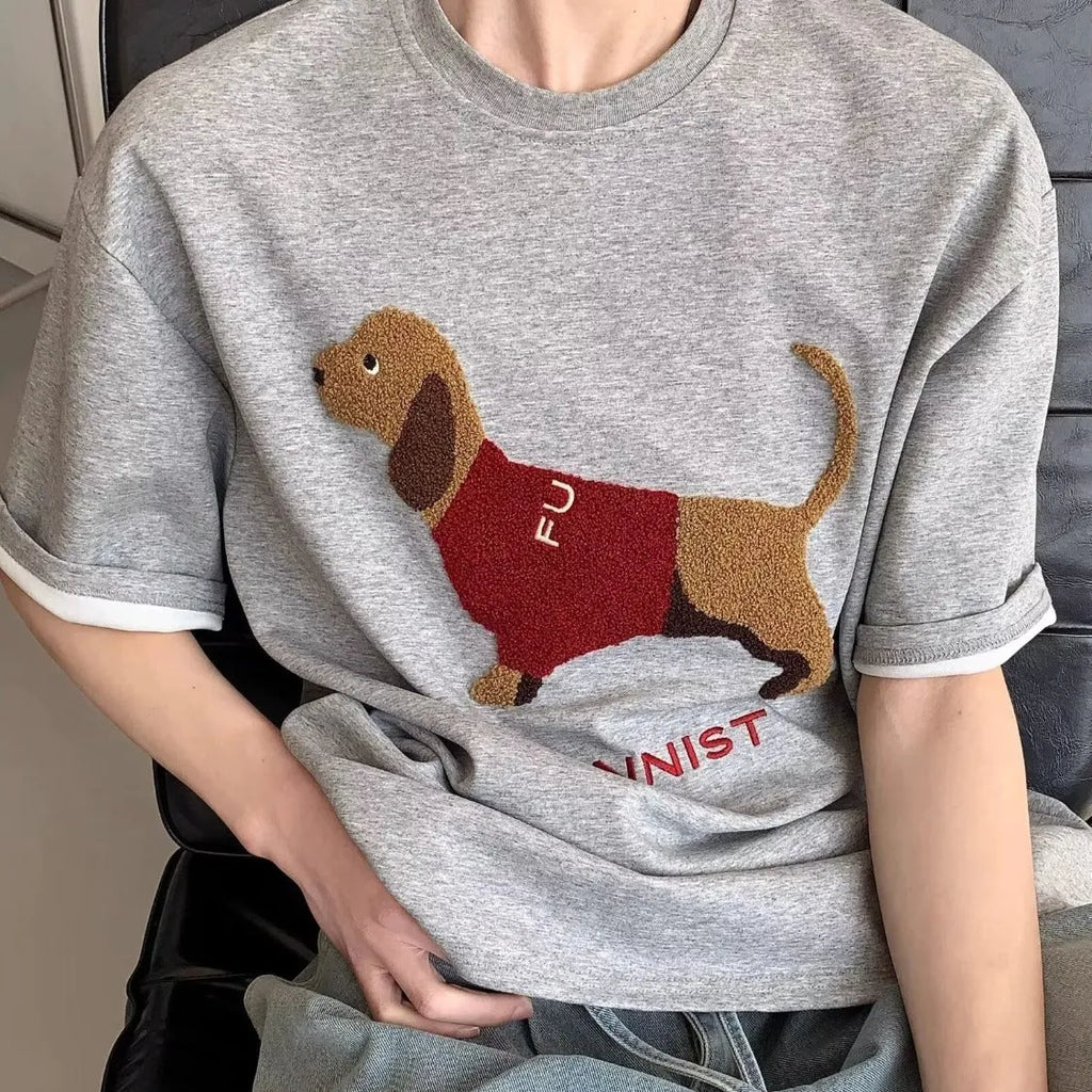 Men's grey cotton t-shirt with an embroidered black and white dachshund dog design on the chest.