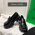 A pair of wide fit leather loafers in a slip-on style with a rubber sole, shown in a choice of finishes.